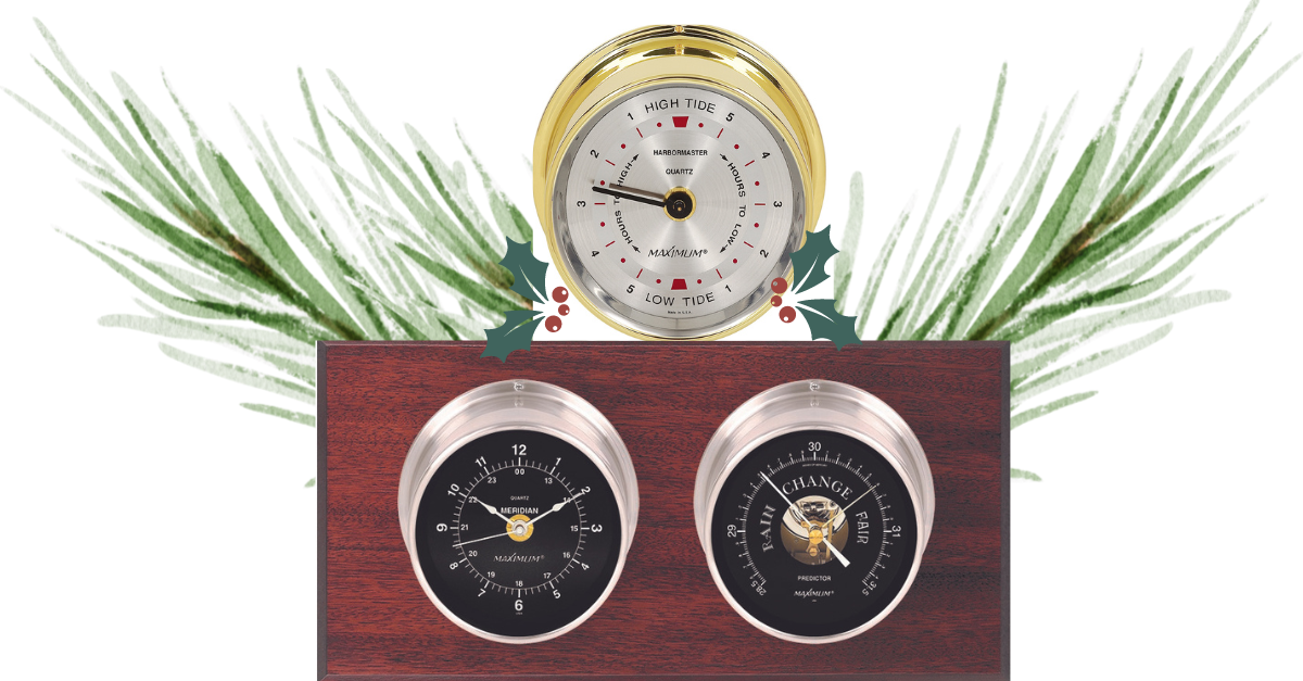 The Mariner weather instruments; one round, gold tide clock and two round, silver weather instruments mounted on a wood background.